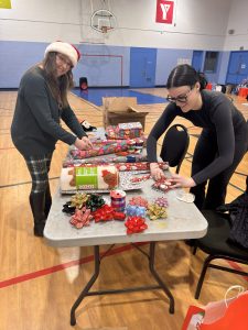Volunteer | volunteers help wrap presents for the Angel Tree project